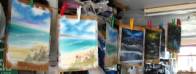 paintings hanging up to dry in garage